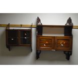AN EDWARDIAN WALNUT TWO DOOR HANGING BOOKCASE together with another hanging bookcase and a stool (