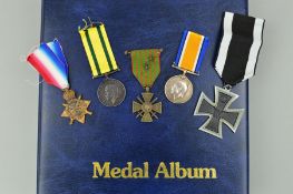 A LARGE MEDAL ALBUM, containing a number of WWI, WWII medals mainly original but also a number of