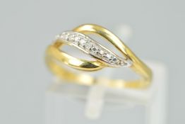 A 9CT GOLD DIAMOND DRESS RING, designed as three curved lines, the central line set with four single