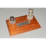 AN ELIZABETH II WALNUT DESK STAND, of rectangular form, moulded pen rest inset rectagular silver