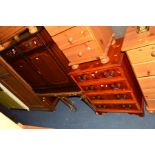 A MODERN MAHOGANY TWO DOOR CABINET, a yew wood hi-fi cabinet, a mahogany nest of three/coffee table,