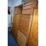 AN AUSTIN SUITE TEAK CHEST OF FOUR LONG GRADUATED DRAWERS with rosewood finish handles, on four