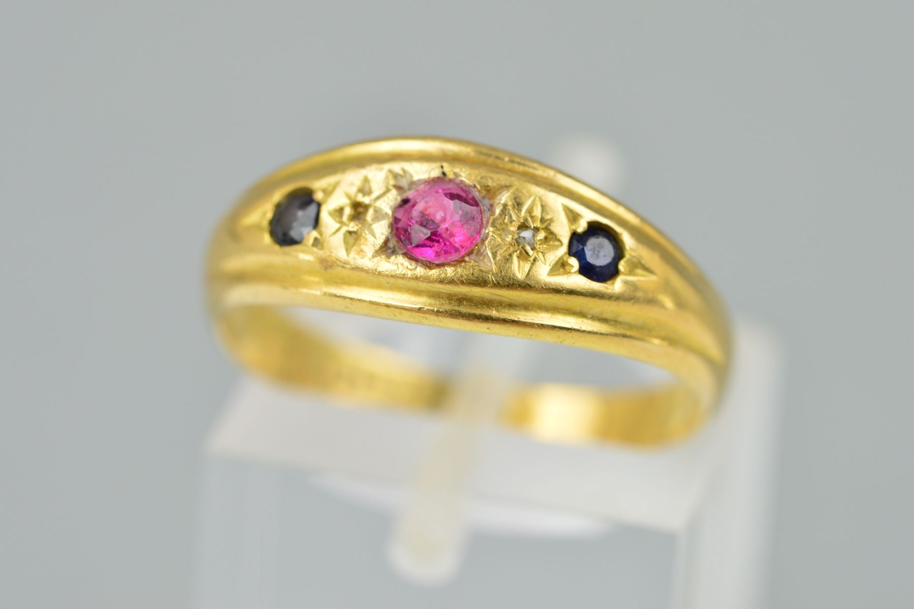 AN EARLY 20TH CENTURY 18CT GOLD RUBY, SAPPHIRE AND DIAMOND RING, designed as a central circular ruby - Image 2 of 2