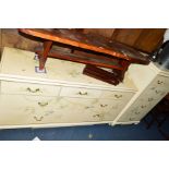 A LOW MODERN HEAVY CHEST OF THREE OVER FOUR DEEP DRAWERS, cream ground with painted floral and