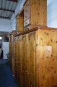 A DUCAL PINE FOUR DOOR WARDROBE, approximate width 191cm x depth 60cm x height 192cm, together