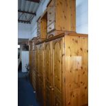 A DUCAL PINE FOUR DOOR WARDROBE, approximate width 191cm x depth 60cm x height 192cm, together