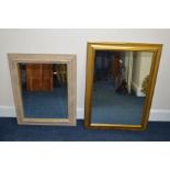 A MODERN BEVELLED EDGE WALL MIRROR, together with another mirror (2)