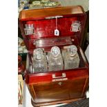 AN EDWARDIAN COMBINED TANTALUS AND GAMES COMPENDIUM TYPE INLAID BOX, fitted with three glass