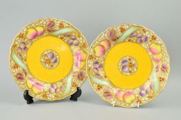 TWO ROYAL WORCESTER CABINET PLATES, fruit decorated with gilt overlay, puce backstamp and No.1734,