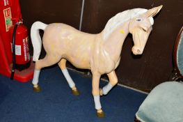 A PAINTED RESIN HORSE
