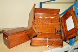 AN OAK STATIONARY CABINET with inbuilt perpetual calender, approximate height 33cm x 32cm (no