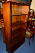 A MAHOGANY OPEN BOOKCASE and a similar oval coffee table (2)