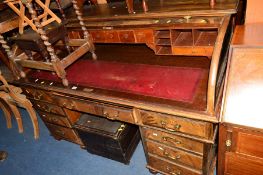 AN EDWARDIAN MAHOGANY ROLL TOP DESK with nine various drawers, approximate width 150cm x depth