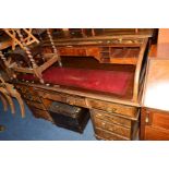 AN EDWARDIAN MAHOGANY ROLL TOP DESK with nine various drawers, approximate width 150cm x depth