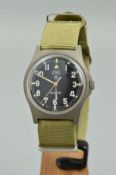 A CWC MILITARY QUARTZ WRIST WATCH, the circular head with black face and Arabic numerals, stamped to