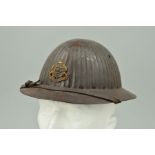 A WWI ERA, EARLY ISSUE BRODIE STYLE HELMET, which is believed to have been made in the UK and was