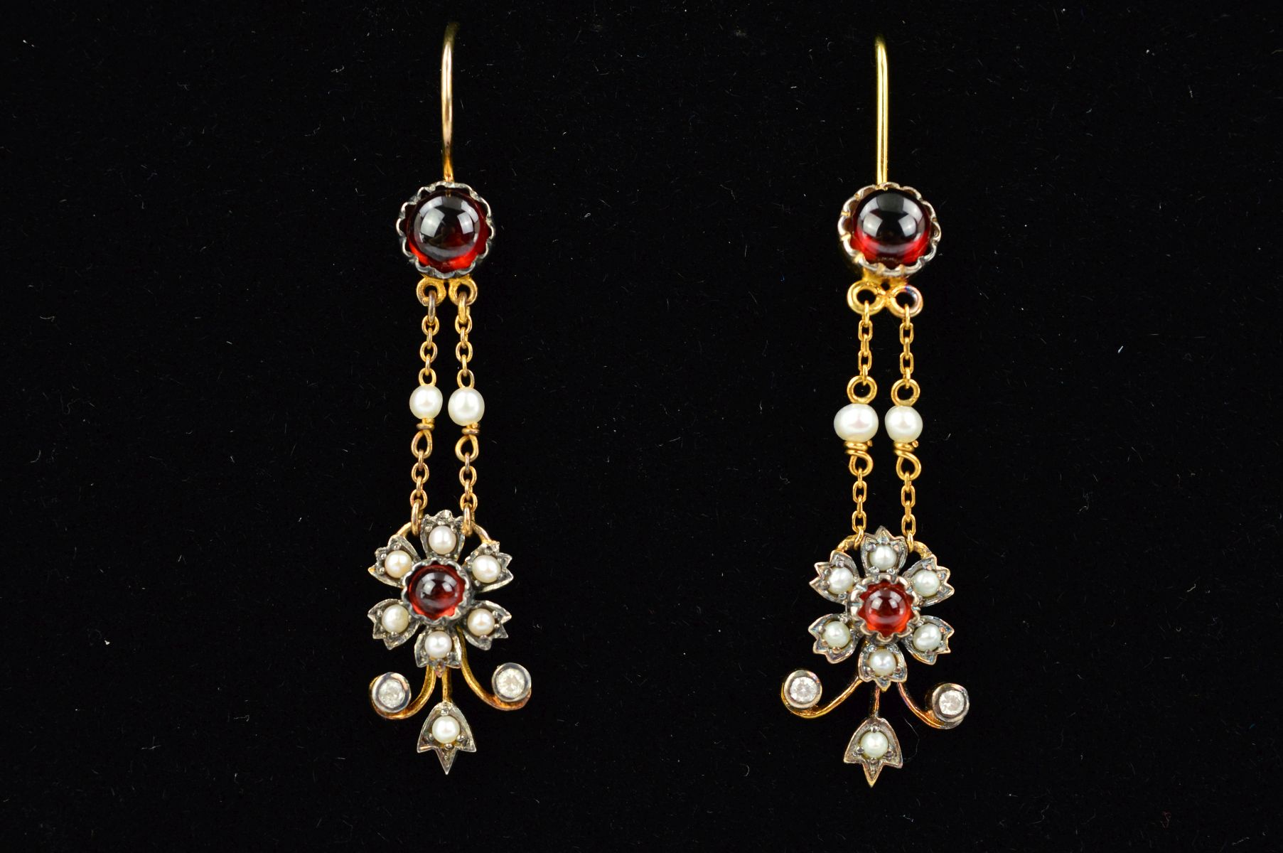 A PAIR OF GARNET, SPLIT PEARL AND DIAMOND EARRINGS, each designed as a circular garnet cabochon