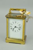 AN EARLY 20TH CENTURY BRASS CASED CARRIAGE CLOCK, white enamel dial, Roman numerals, fire glazed