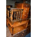 A REPRODUCTION OAK COFFEE TABLE, an oak nest of three tables and an oak bedside cabinet (3)