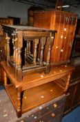 A REPRODUCTION OAK COFFEE TABLE, an oak nest of three tables and an oak bedside cabinet (3)