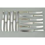 A SET OF SIX ELIZABETH II SILVER HANDLED TABLE KNIVES, together with six matching dessert knives,