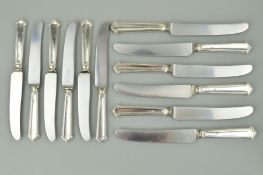 A SET OF SIX ELIZABETH II SILVER HANDLED TABLE KNIVES, together with six matching dessert knives,