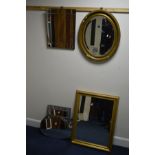 A MODERN OVAL GILT FRAMED BEVELLED EDGE WALL MIRROR, a rectangular wall mirror and four other