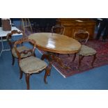 A VICTORIAN BURR WALNUT OVAL TILT TOPPED LOO TABLE, approximate width 150cm x depth 110cm x height