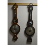 A GEORGIAN WALNUT BANJO BAROMETER, together with a similar banjo barometer (2)