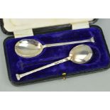 A CASED PAIR OF GEORGE V SILVER SEAL TOP PRESERVE SPOONS, engraved decoration to the handles,