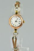 AN EARLY 20TH CENTURY WATCH WITH 9CT GOLD ROLEX CASE, the circular 9ct gold head with white face and