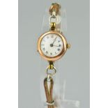 AN EARLY 20TH CENTURY WATCH WITH 9CT GOLD ROLEX CASE, the circular 9ct gold head with white face and