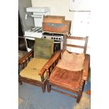 TWO EARLY 20TH CENTURY OAK FIRESIDE CHAIRS with adjustable backs, together with two wooden crates (