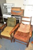 TWO EARLY 20TH CENTURY OAK FIRESIDE CHAIRS with adjustable backs, together with two wooden crates (