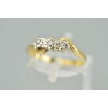 A 9CT GOLD THREE STONE DIAMOND RING, the three brilliant cut diamonds with illusion settings to