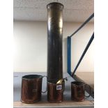 A GRADUATED SET OF BRASS AND COPPER LIQUID MEASURES, 1/2, 1 and 2 pints, a brass naval shell