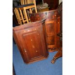 A GEORGIAN OAK BOWFRONT TWO DOOR CORNER CUPBOARD, together with another oak corner cupboard (2)