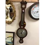 A GEORGIAN MAHOGANY AND INLAID BANJO BAROMETER