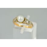 AN EARLY 20TH CENTURY CULTURED PEARL AND DIAMOND THREE STONE RING, estimated old Swiss cut diamond