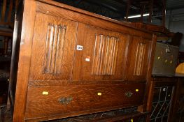 AN OAK LINENFOLD BLANKET BOX with a single drawer, together with a mahogany corner cabinet and a