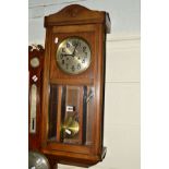 A MID 20TH CENTURY OAK WALL CLOCK