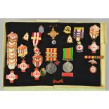 A CARDBOARD BOXED FRAME OF MEDALS AND BADGES, all relating to the service of a V.B. Thompson in