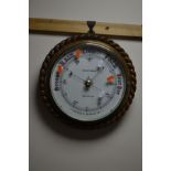 AN EDWARDIAN CIRCULAR OAK ROPE EDGE ANEROID BAROMETER, marked J BLOUNT THOMAS, SOUTHAMPTON,