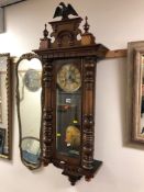 A VICTORIAN WALNUT EIGHT DAY VIENNA WALL CLOCK with an eagle pendant, dial marked GB for Gustav