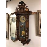 A VICTORIAN WALNUT EIGHT DAY VIENNA WALL CLOCK with an eagle pendant, dial marked GB for Gustav