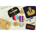A WWII GROUP OF THREE MEDALS AND PATCHES, attributed to D.J. Baldwin, Merchant Navy, 1939-45,