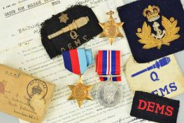 A WWII GROUP OF THREE MEDALS AND PATCHES, attributed to D.J. Baldwin, Merchant Navy, 1939-45,