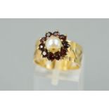 A 9CT GOLD GARNET AND PEARL CLUSTER RING, the central cultured pearl within a circular garnet