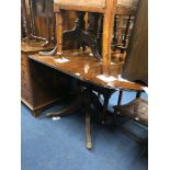 A MODERN MAHOGANY DROP LEAF PEDESTAL TABLE