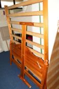 A 4' 6'' PINE BED FRAME